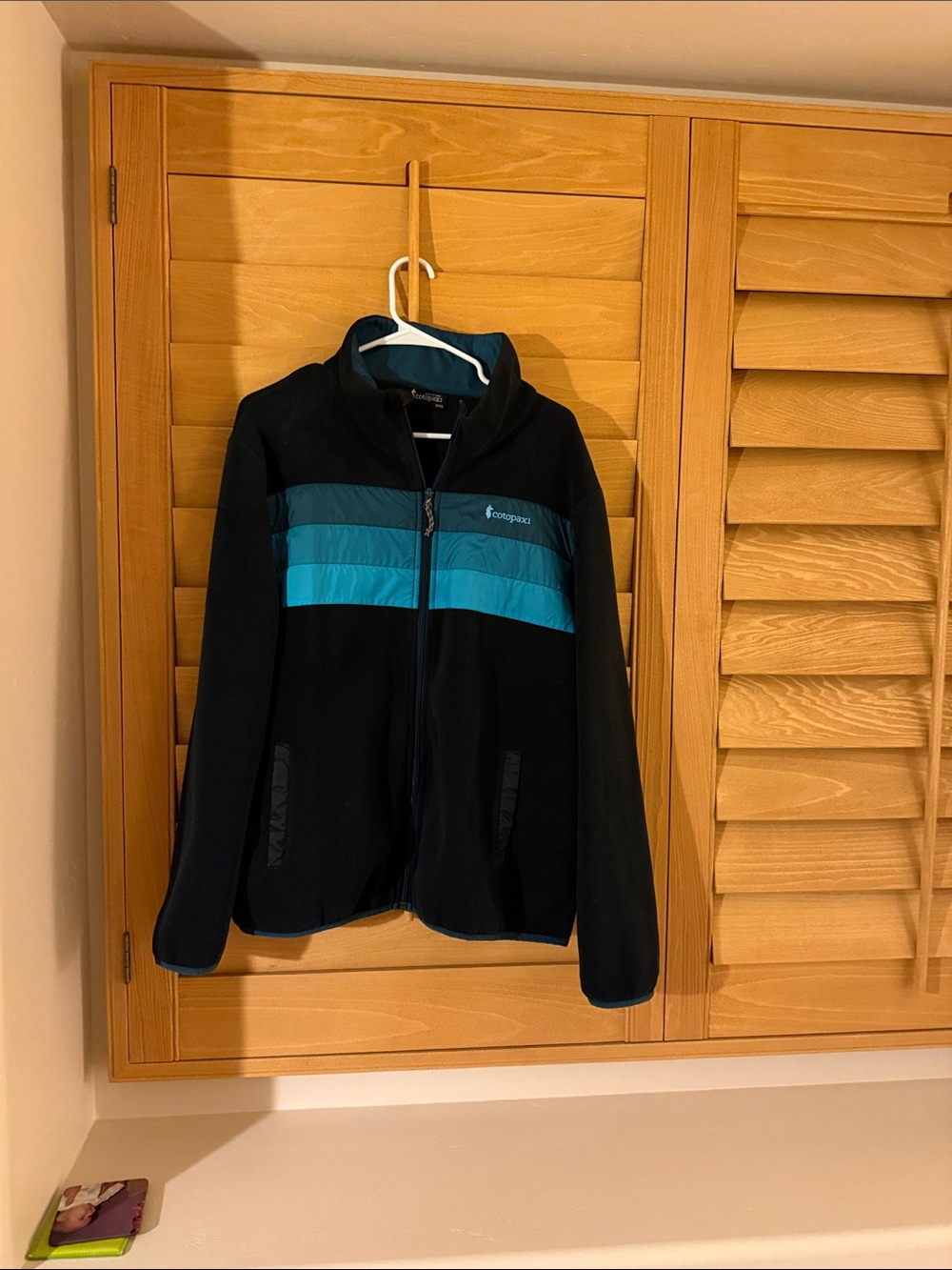 cotopaxi Black Utility Jacket with Teal Chest Stripes